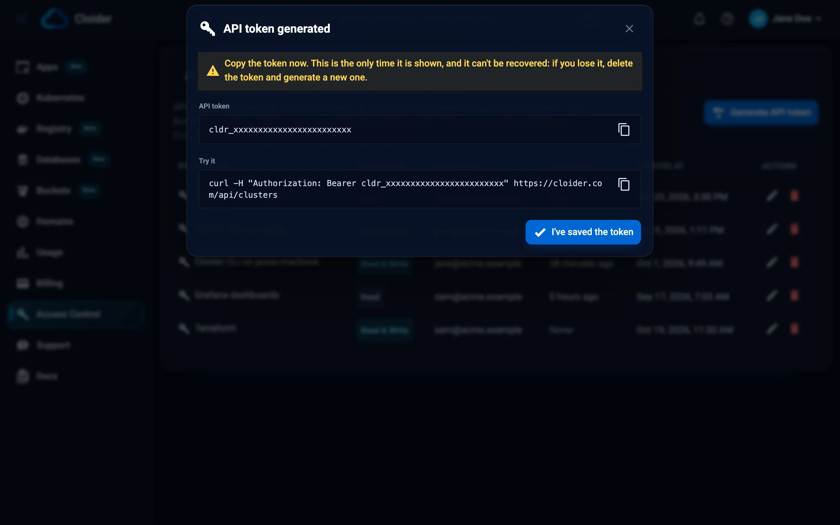 The API token generated dialog warning to copy the token now, showing the token, a Try it curl command and the I've saved the token button